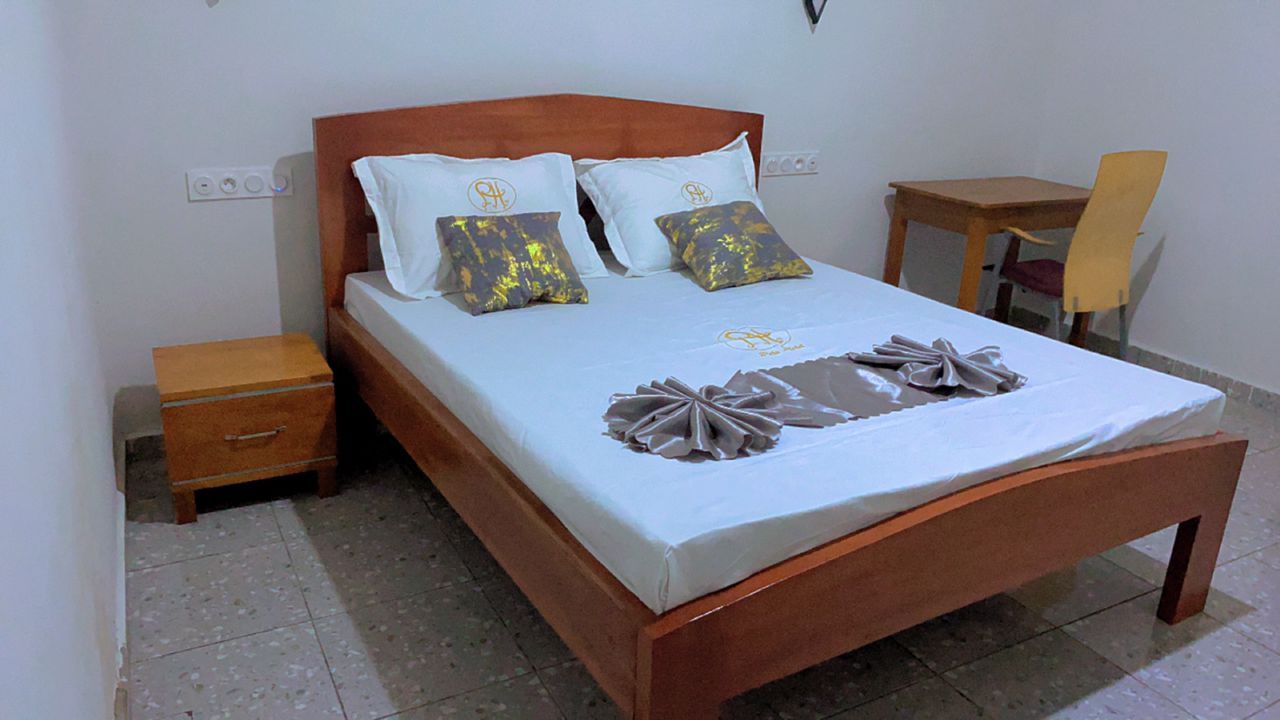 elegant hotel standard room warm tones modern